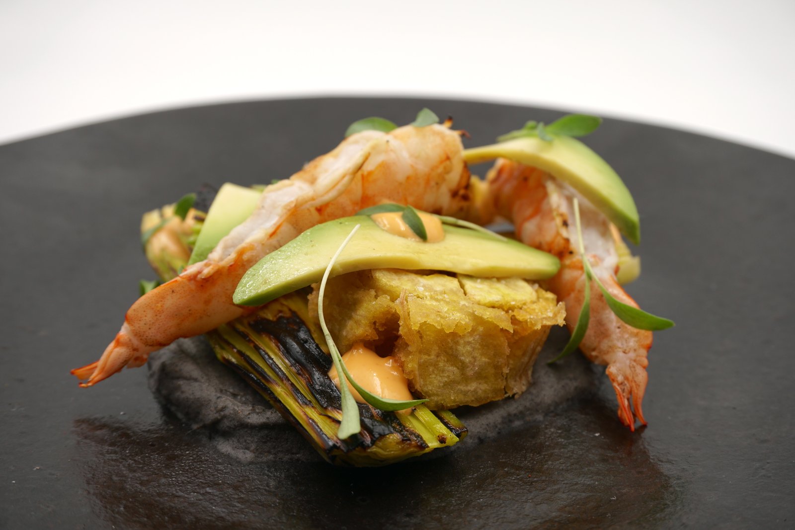 Grilled Prawn with crispy plantain, charred leek, chili aioli, avocado